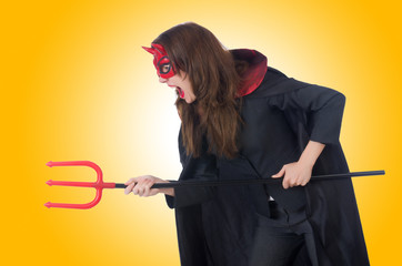 Female wearing devil costume and trident