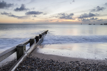 seascape with groin and stones in Swanage bay