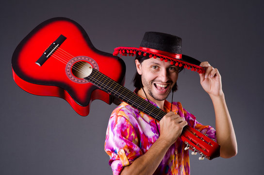 Man Wearing Sombrero With Guitar