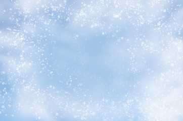 Falling snowflakes on  blue background