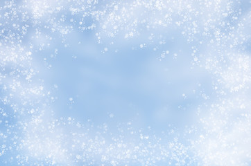 Falling snowflakes on  blue background
