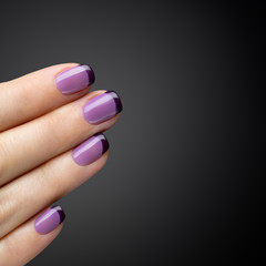 Beautiful manicure, polish is a violet color.