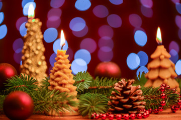 Candle with pine cone and balls decoration