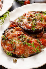Grilled eggplant stuffed tomatoes, cheese and herbs