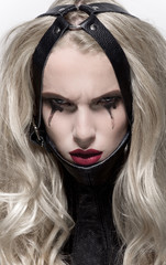 Portrait of blonde woman in BDSM neck collar