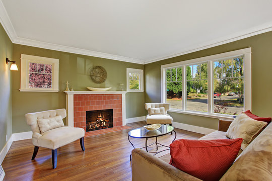 Olive tone family room with fireplace