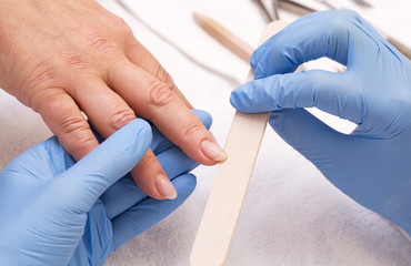 woman doing manicure beauty salon varnish wellness