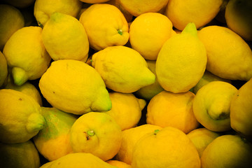 food background. closeup on tropical fruits lemons.