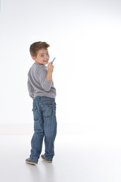 sly child smiling to the camera