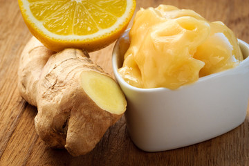 ginger root, honey and lemon on wooden rustic table.