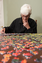 Jigsaw puzzle put together by an eldery woman