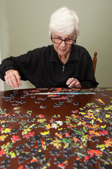 Jigsaw puzzle put together by an eldery woman