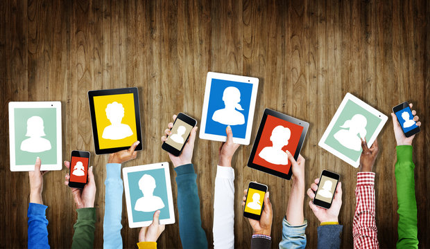 Group of Hands Holding Digital Devices with Avatar Symbols