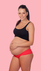 Fototapeta na wymiar Brunette pregnant woman in underwear