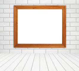 blank wood frame in room with brick wall and wood floor