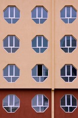 Fototapeta premium Building Facade with Hexagonal Windows.