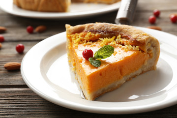 Homemade pumpkin pie on table