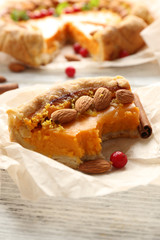 Homemade pumpkin pie on table