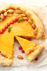 Homemade pumpkin pie on table