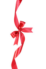 Shiny red ribbon with bow isolated on white