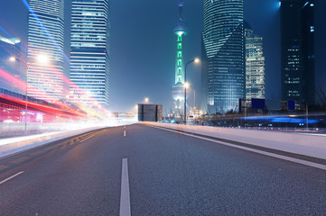 Asphalt road and modern city