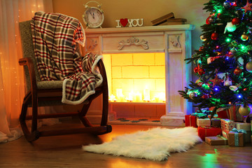 Beautiful Christmas interior with fireplace and fir tree