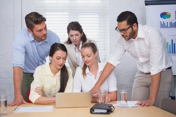 Business people working together at meeting on computer