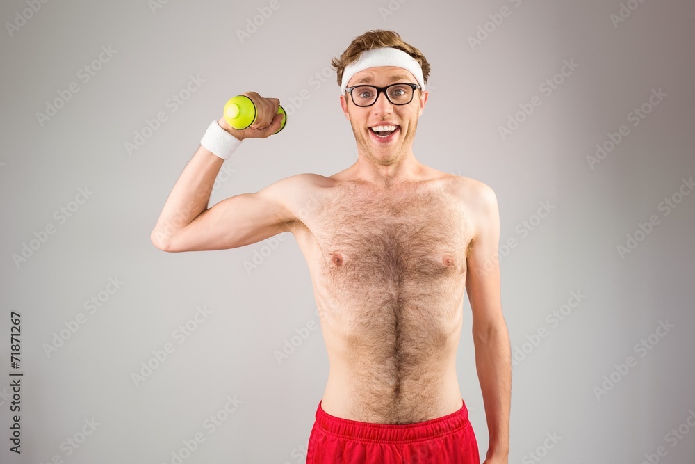 Poster geeky shirtless hipster posing with dumbbell