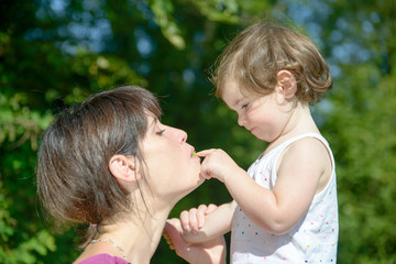 a beautiful mother and daughter playing together