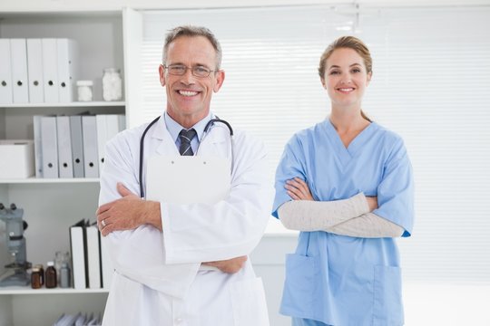 Smiling doctor with fellow co worker