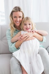 Portrait of a mother and her daughter hugging