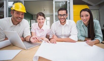 Architecture team working together at desk