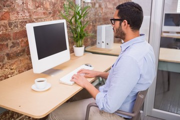 Businessman using computer at desk