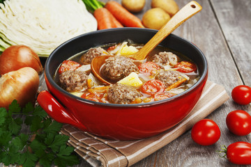 Cabbage soup with meatballs and tomatoes