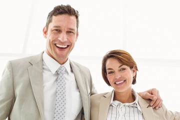 Happy business couple in office