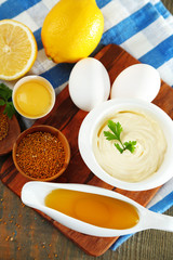 Mayonnaise ingredients on wooden background