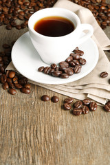 Cup of coffee and coffee beans with chocolate glaze