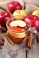Apple cider with cinnamon sticks, spices and fresh apples