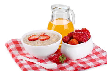 Tasty oatmeal with berries and juice isolated on white