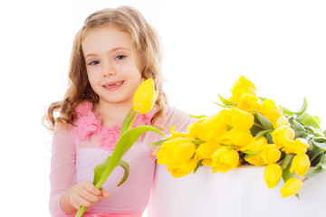 beautiful child;  girl with bouquet of yellow tulips isolated