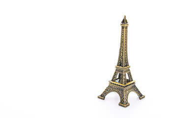 Fototapeta na wymiar Eiffel Tower toy isolated on white background