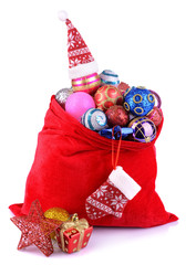 Red bag with Christmas toys isolated on white