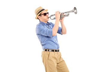 Young musician playing a trumpet
