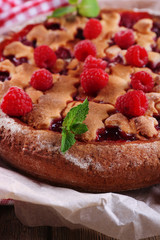 Tasty cake with berries on table close-up