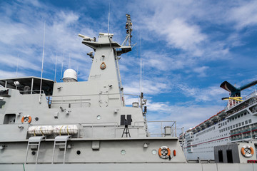 Fototapeta premium Naval Boat by Cruise Ship