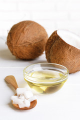 Coconut oil on table on light background