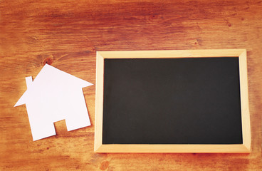 top view of empty blackboard with room for text and house shaped