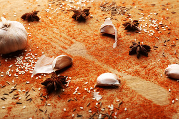 Spices on table with fork silhouette, close-up