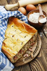 Pie with cabbage and sausages