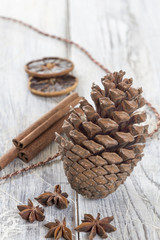 fir cone and decoration on white table